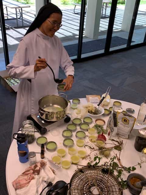 Sister Malia Wong making natural ointments