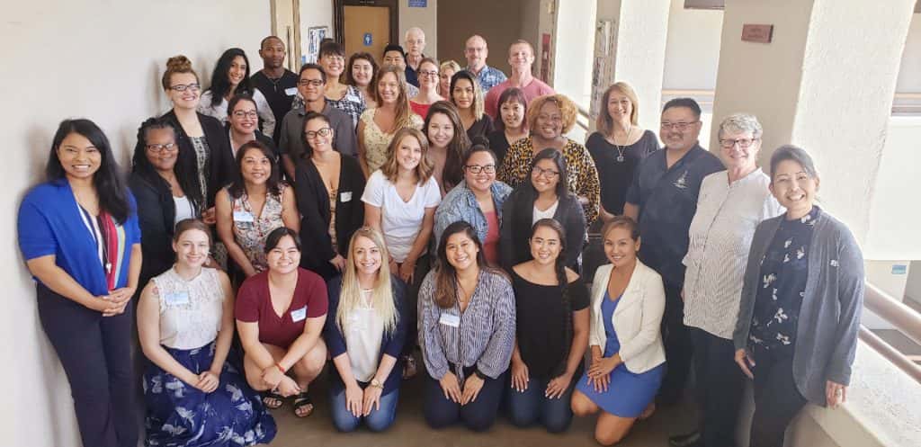 Master of Science in Counseling Psychology students and faculty pose for a group picture during new student orientation