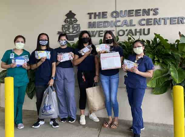 Chaminade's HOSA Club delivering care packages to Queen's Medical Center