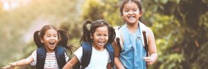 Three elementary students running