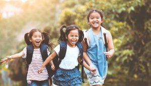 young girls running together