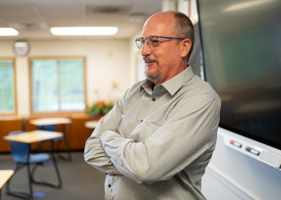Dr. Dale Fryxell (dean, School of Education and Behavioral Sciences) standing in classroom