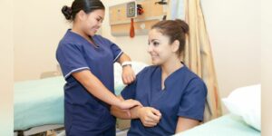 certified nursing aide CNA students checking blood pressure