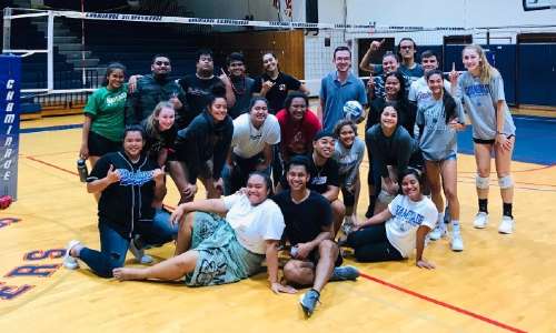 Izzie Krupa '22 posing for the camera with other Chaminade Silverswords after an intramural volleyball game