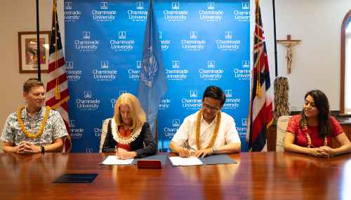 Nikhil Seth, Executive Director of UNITAR, and Dr. Lynn Babington, Chaminade President, signing the partnership agreement