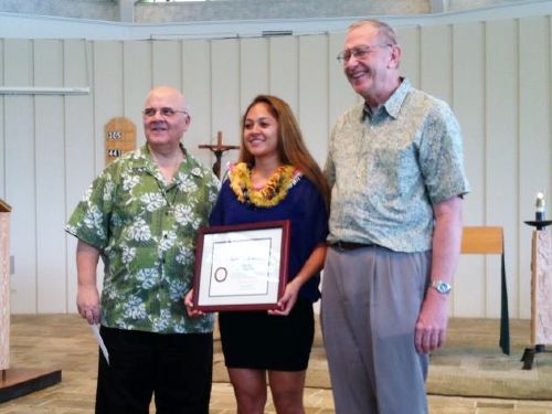 Dominique Bocanergra '13 receiving the Founders' Award, standing with Bro. Bernie Ploeger and Fr. George Cerniglia