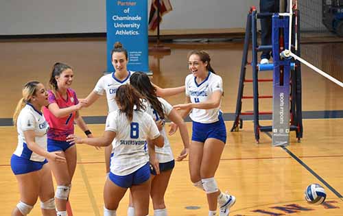 Chaminade University's Women's Volleyball team 2021 in a huddle after a good play
