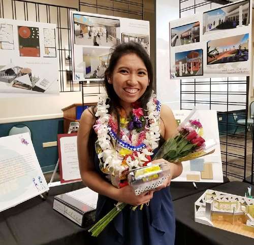 Nicolle Soriano '18 posing in front of her display at Na Liko Naauao 2018