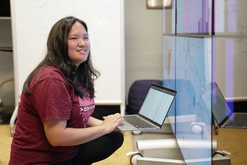 Taylor Ishisaki reviewing data science information