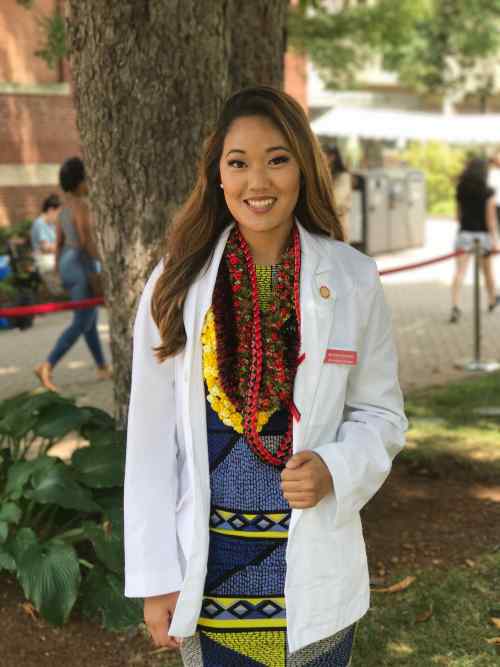 Meshelle Hirashima wearing her white coat at Boston University