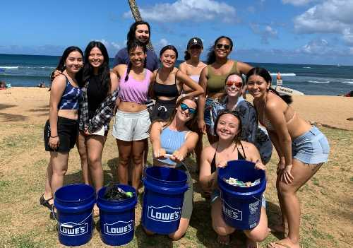 Sustainability Council Club a the beach picking up trash