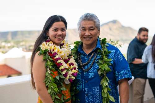 Lucy Lee '23 and Ramsay Taum posing for the camera with Diamond Head in the background