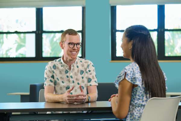 An academic advisor speaking with a student