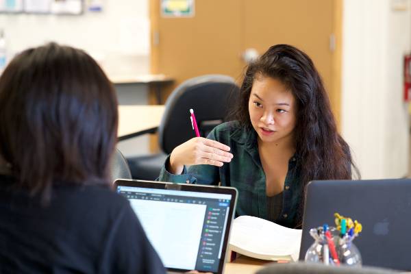 a student tutoring another student