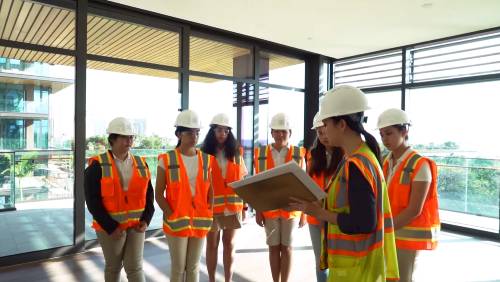 Erin Kirihara '06 giving a tour to Girl Scouts Hawaii
