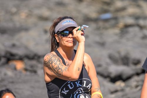 Kimmy Tanaka '22 looking through an instrument during an Environmental Studies class field trip