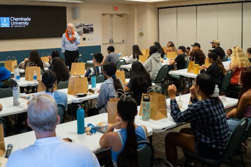 Fr. Jim Heft, SM, speaking to students