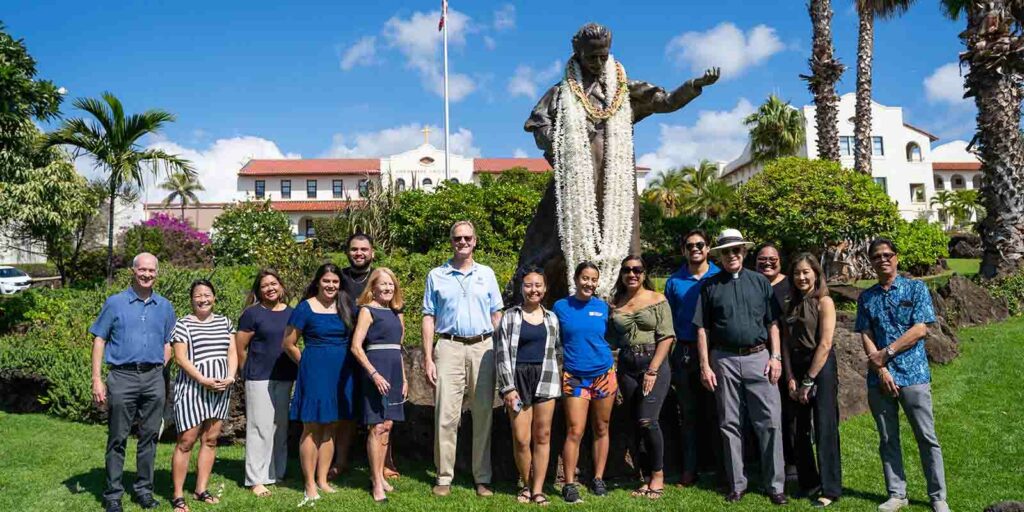 Founders' Week lei-draping ceremony in front of Father Chaminade statue