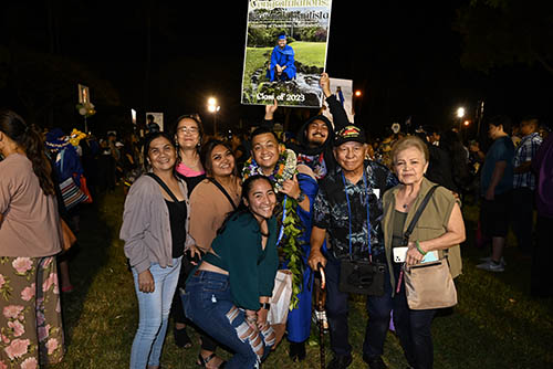 MBA graduate Jeremiah Bautista poses with family and friends.