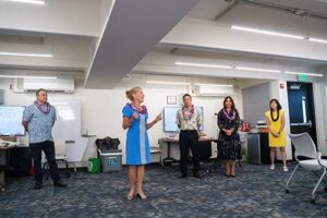 Chaminade president Dr. Lynn Babington is flanked by, from left, Andrew Rosen, president and CEO of Hawaii State FCU, Greg Young, president and CEO of HawaiiUSA, Dr. Annette Santos, interim dean, School of Business and Communication, and Dr. Guanlin Gao, director of Chamiande’s Economic Education Center for Excellence and associate professor.