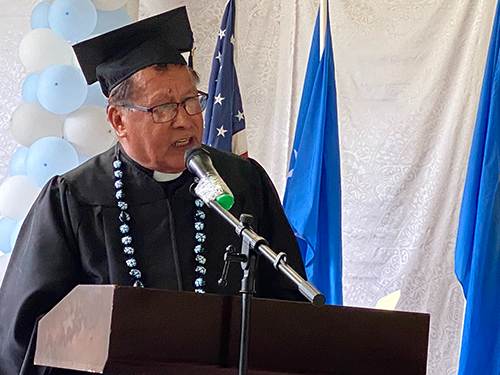 Caroline Islands Bishop Julio Angkel addresses graduates during the Commencement Ceremony.