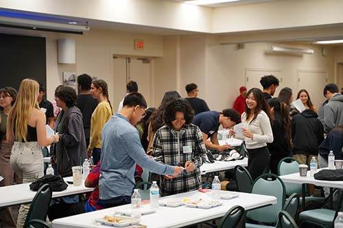 Students circled the room to fill out their bingo-like cards.