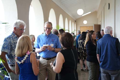 Fr. Chris Wittman talks with Dr. Lynn Babington and her husband Dr. Randy Carpenter, and Tertia Freas.