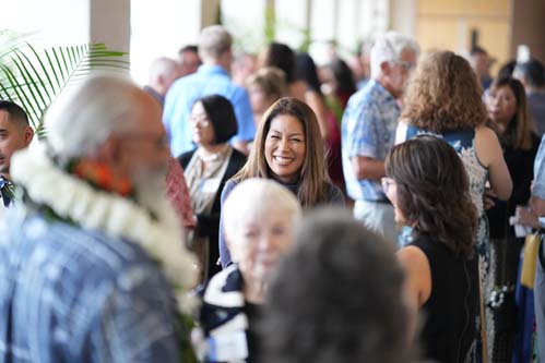 Chaminade's Director of Development, Heidi Bow, shares a laugh with guests.