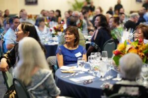 Cathy Ching listens to Dr. Lynn Babington's opening remarks.