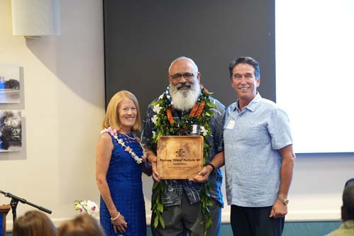 Athletics Director Tom Buning and Chaminade President Dr. Lynn Babington pose next to Hall of Fame inductee, Chico Furtado '80.