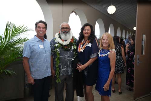 Athletics Director Tom Buning and Chaminade President Dr. Lynn Babington flank Hall of Fame inductees, Chico Furtado '80 and Teri Chong '92.