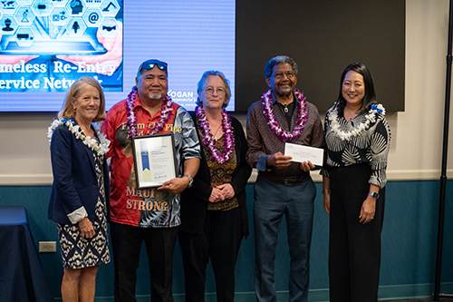 WorkNet members, from left, Mo Kalaikai, Stephanie Ann and Chas Williams were congratulated by Chaminade President Lynn Babington, Ph.D., far left, and American Savings Bank’s President and CEO Ann Teranishi.