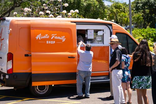 Lines formed as employees waited their turn to get a cup of strawberry, green river or pineapple sherbert from the Asato Family Shop.