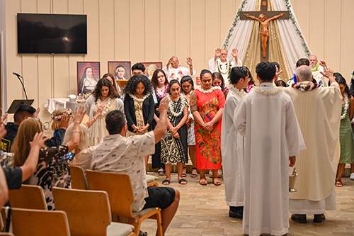 Graduating students are honored during the Baccalaureate Mass at Mystical Rose Oratory.
