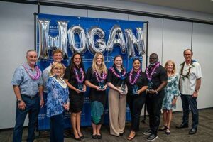 The Hogans and Drs. Lynn Babington and Roy Panzarella pose with this year's awardees, including, from left, Waioli Misajon, Leah Carrington, Liz Devine, Yazmine Esquivel and Voris Crooms.