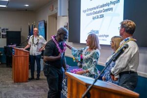 Dr. Lynn Babington presents Voris Crooms with this year's inaugural Hogan Leadership Award.