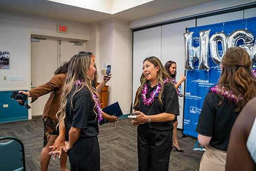 Clara Slate-Liu, left, speaks to Connie Kramer about her reason for becoming a Hogan Entrepreneurial Program participant.