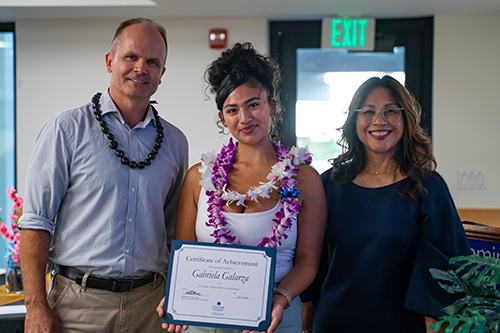 Drs. Eddie Merc and Annette Santos present Gabriela Galarza with the Academic Achievement in Accounting.