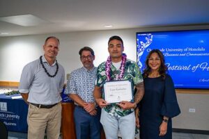 Drs. Eddie Merc, Asoke Datta and Annette Santos pose with Taisyn Kauhaahaa, winner of the Academic Achievement in Business Administration.