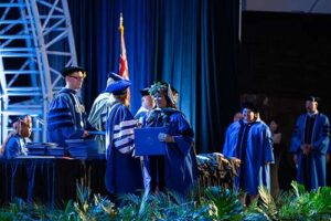 Graduates accepted their degrees through the course of the night.