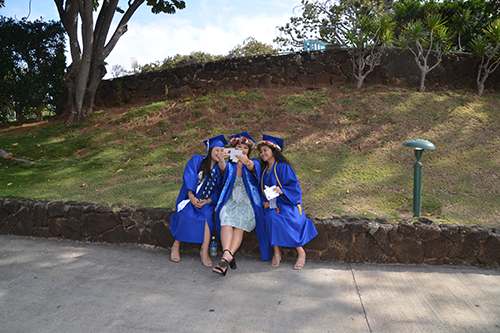 Graduating students took a selfie just inside the entrance of Waikiki Shell.