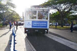 Four trolleys shuttled students, families and friends from Chaminade to the Waikiki Shell.