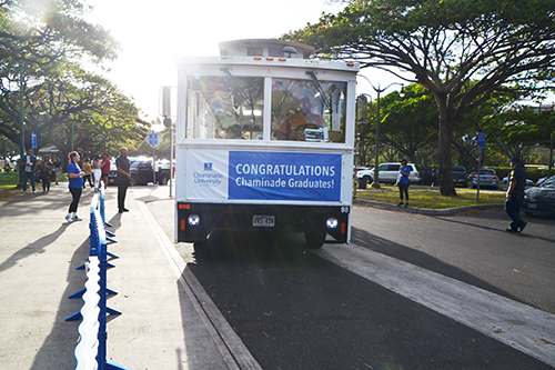 Four trolleys shuttled students, families and friends from Chaminade to the Waikiki Shell.
