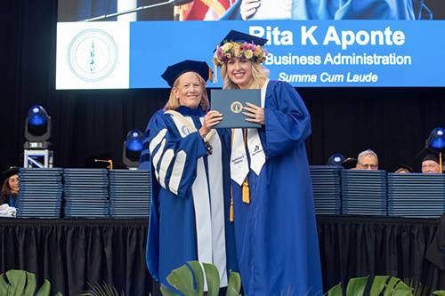 Rita Aponte, Senior Manager at Bank of Hawai‘i’s People Service Center, received her degree in Business Administration from Chaminade University on Saturday evening.