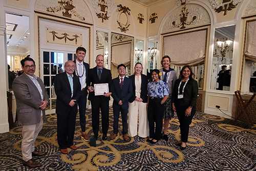 Chaminade School of Business and Communication faculty members, from left, Asoke Datta, Richard Kido, Wera Panow-Loui and Interim Dean Annette Santos attended the IACBE Annual Conference and Meeting Assembly with students, from left, Ross Reeves, Alexander Hernandez, Liz Devine and Kelsey Sablan.