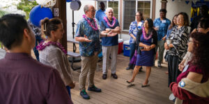 Wearing plumeria lei, from left, Dr. Abby Halston, School of Education and Behavioral Sciences Dean Dale Fryxell, Fr. Martin Solma and Dr. Blendine Hawkins welcomed recent graduates of the M.S. Counseling Psychology program back to campus for a mini reunion.