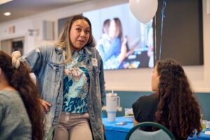 Paige Garcia shares a moment with fellow alumna.