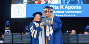 Graduating Summa Cum Laude, Rita Aponte earned her bachelor's degree through Chaminade's FLEX Online Program. Chaminade President Dr. Lynn Babington presented her diploma during Commencement.