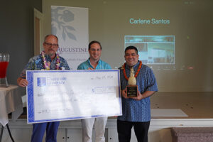 St. Anthony School Head of School MauiDavid Kenney, center, accepted the prize money for preschool teacher Kathleen DeLima from Llewellyn Young, Ph.D., right, superintendent of Hawaii Catholic Schools and Chaminade School of Education and Behavioral Sciences Dean Dr. Dale Fryxell.