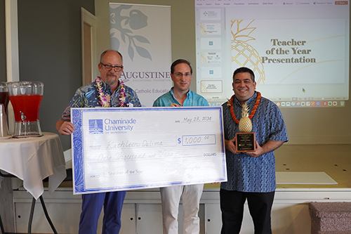 St. Anthony School Head of School Maui David Kenney, center, accepted the prize money for preschool teacher Kathleen DeLima from Llewellyn Young, Ph.D., right, superintendent of Hawaii Catholic Schools and Chaminade School of Education and Behavioral Sciences Dean Dr. Dale Fryxell.
